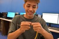 student making cable